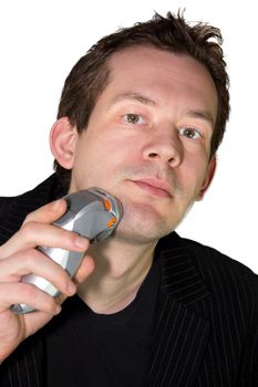 Picture of a man shaving with a shaver