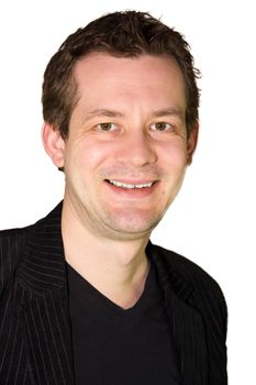 Picture of a smiling man in a dress jacket with a black tshirt