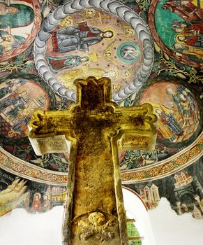 Stone cross and religious painting, traditional Romanian symbols