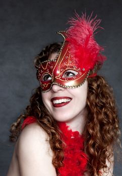 Lady in a red mysterious venetian mask