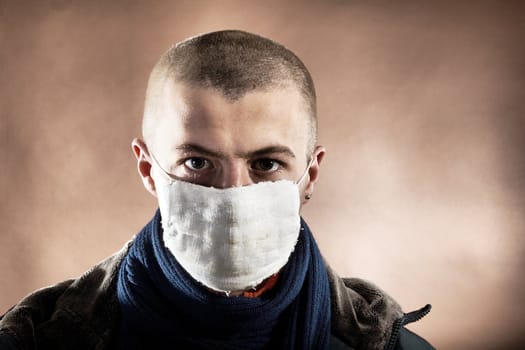 A man with a protective mask on brown background