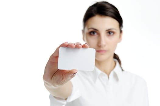 Young businesswoman holding blank businesscard in hand. Focus on card 