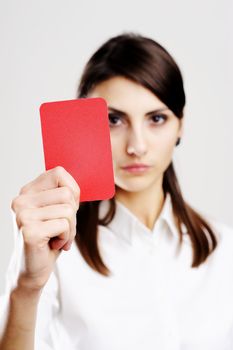 An image of young beautiful woman holding red card