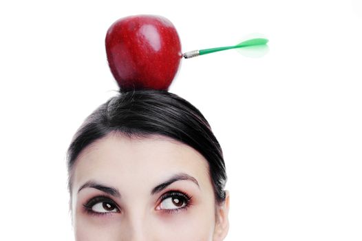 An image of girl with apple on her head. Apple with dart.