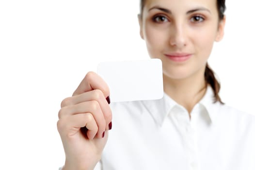 Young businesswoman holding blank businesscard in hand. Focus on card 