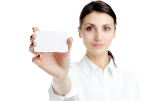 Young businesswoman holding blank businesscard in hand. Focus on card 