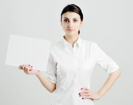 An image of young woman holding white paper