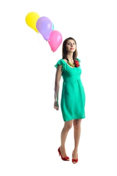 An image of young woman with birthday balloons