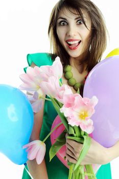 A young beautiful woman with flowers and balloons