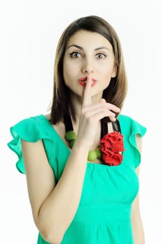 An image of a woman with her finger on her lips