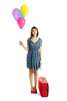 A young beautiful woman with balloons and a bag