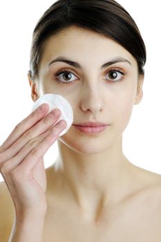 An image of a girl cleaning her face