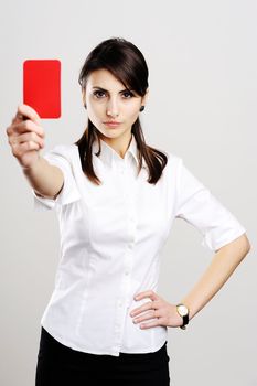 An image of young beautiful woman showing red card