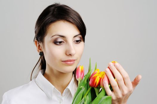An image of a beautiful woman with tulips