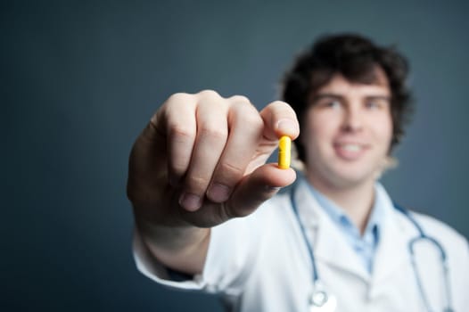 An image of a pill in a doctor's hand