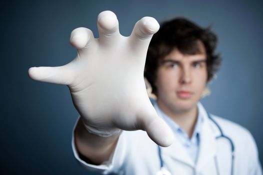 An image of a hand in a latex glove