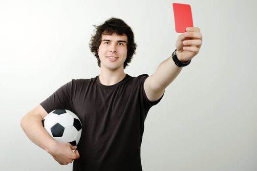 An image of a referee showing red card