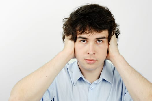 An image of a worker with his ears closed