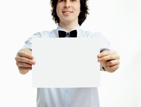 A young handsome man showing a sheet of paper