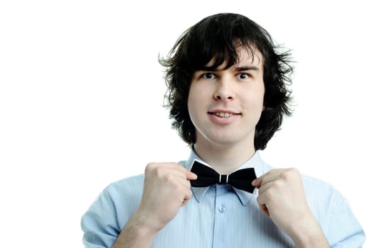 An image of a young waiter touching his tie