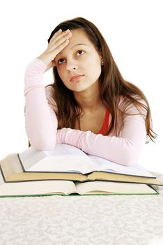 teenage girl leans to opened books, tired of learning, dreaming