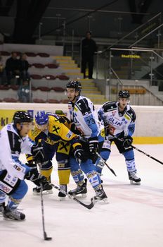 ZELL AM SEE; AUSTRIA - OCT 01: Austrian National League. EKZ (blue jersey) and Linz fighting for each inch on the ice. Game EK Zell am See vs Linz II (Result 5-2) on October 01, 2011 in Zell am See.