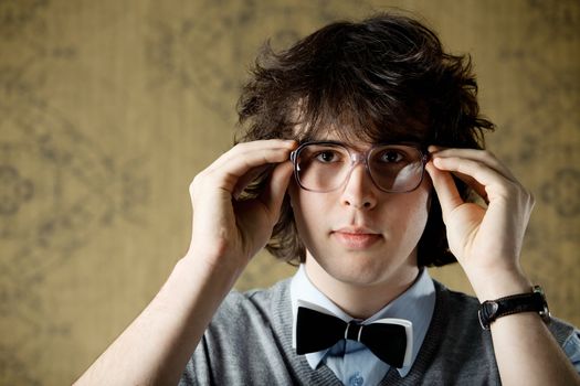 An image of a young man in big glasses