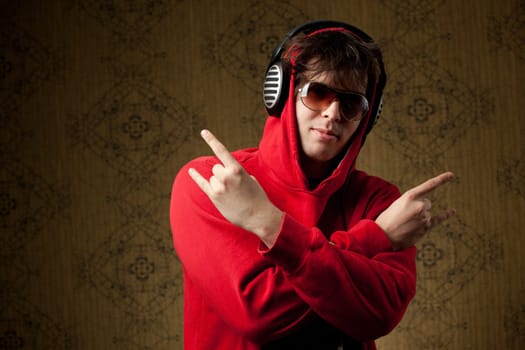 An image of a young boy listening to music in headphones