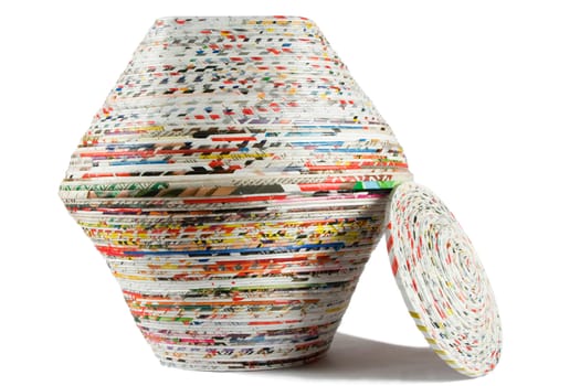 colored basket made from recycled paper on white background