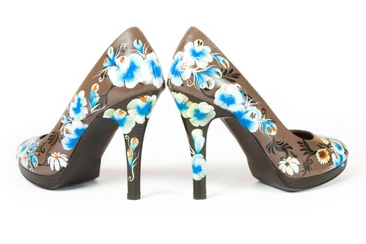 brown women high heels shoes with printed flower on white background