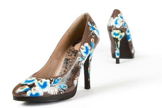 brown women high heels shoes with printed flower on white background