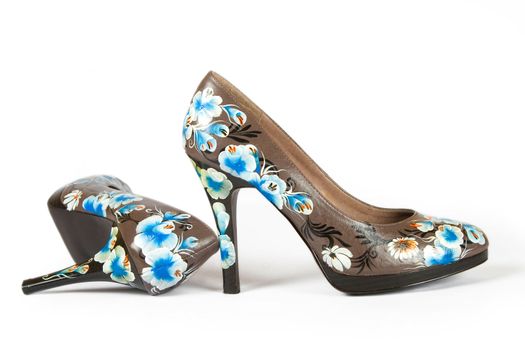 brown women high heels shoes with printed flower on white background