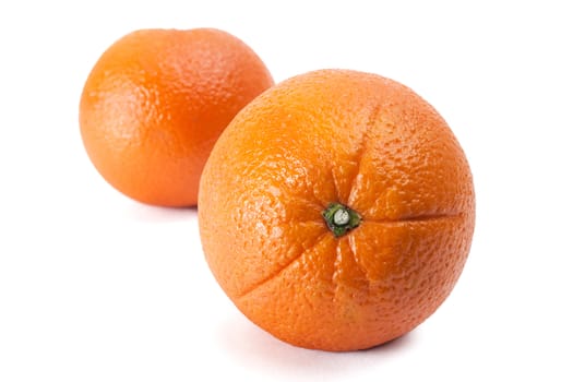 Two ripe oranges it is isolated on a white background