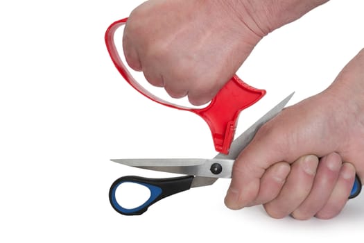 Sharpening of scissors it is isolated on a white background