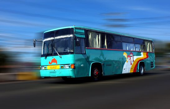 Tourist bus in high speed along the hi-way