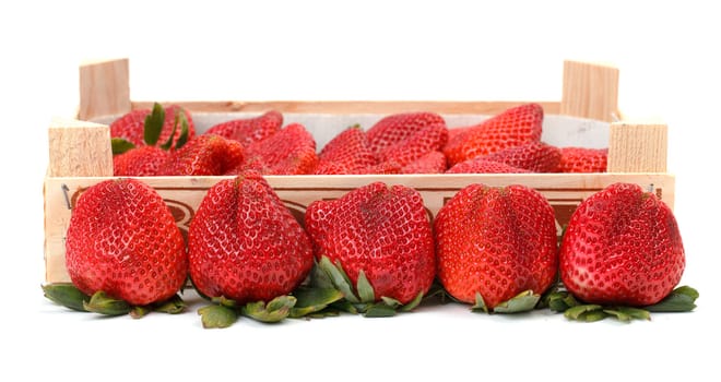 Heap red strawberries in the wooden box
