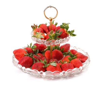 Fresh Strawberries on glass plate over white background