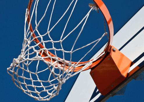 basketball rim and net placed outside on clear sky