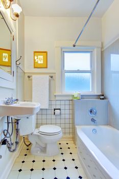 White old simple bathroom with tub and sink.