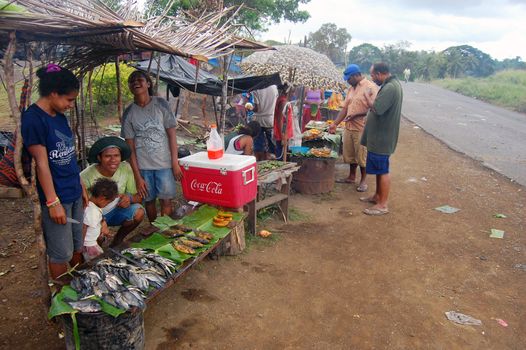 People are saling fruits and vegitables on market at roadside in Papua New Guinea