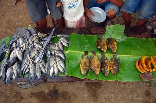 Fish and bananas on the market in Papua New Guinea