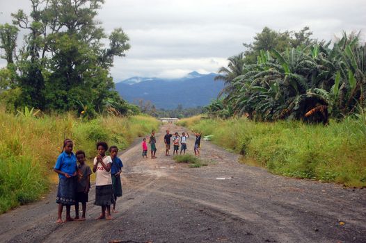 Children on the road, near the village in Papua New Guinea