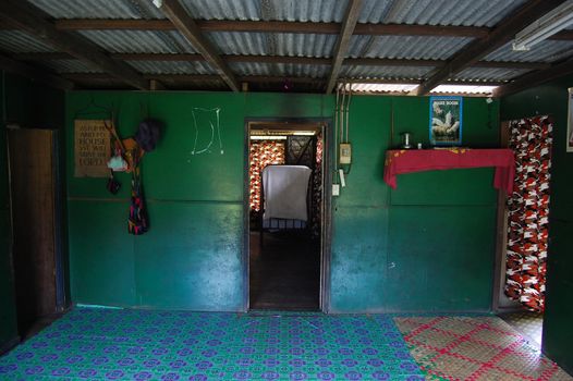 Green wall at the room, village in Papua New Guinea