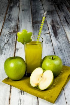a glass of fresh and cold green apple juice 