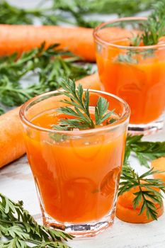 glasses of fresh and cold carrot juice