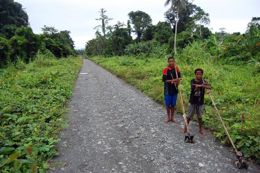 Two boys standing on the road in Papua New Guinea