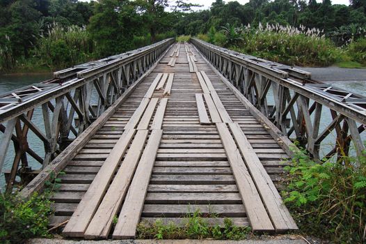 Timber bridge on the road in Papua New Guinea