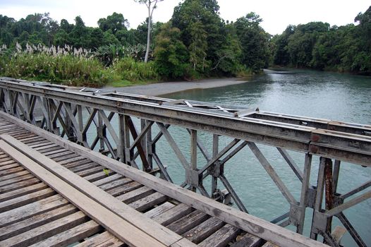 Timber bridge over the river in Papua New Guinea