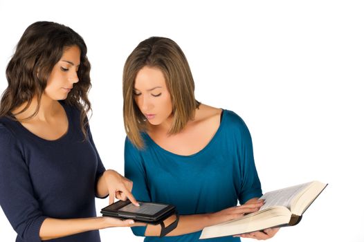 Students holding books, both paper and electronic