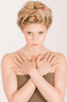 Blonde young woman with hair in chili peppers and Parika